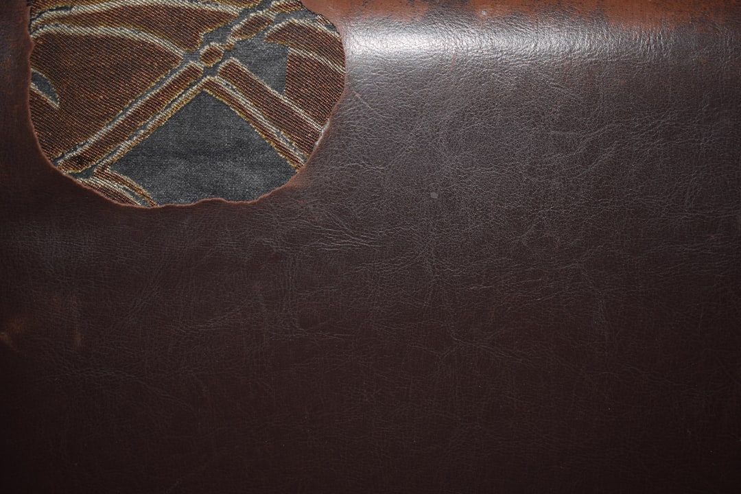 A patterned fabric ball on a dark surface